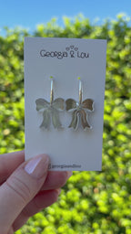 Silver Bow Huggie Hoops